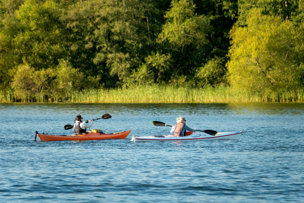 Kayaking in Devoll River Albania in calm, clear waters, with fishing and swimming spots offering a peaceful outdoor experience in the Devoll Valley