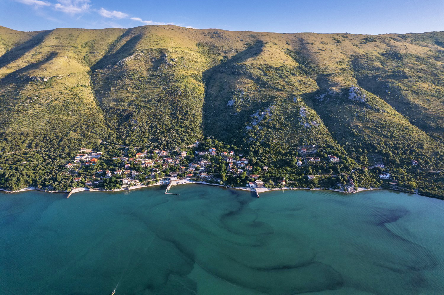 The village of Zogaj on Lake Shkodër, at the foot of Mount Tarabosh