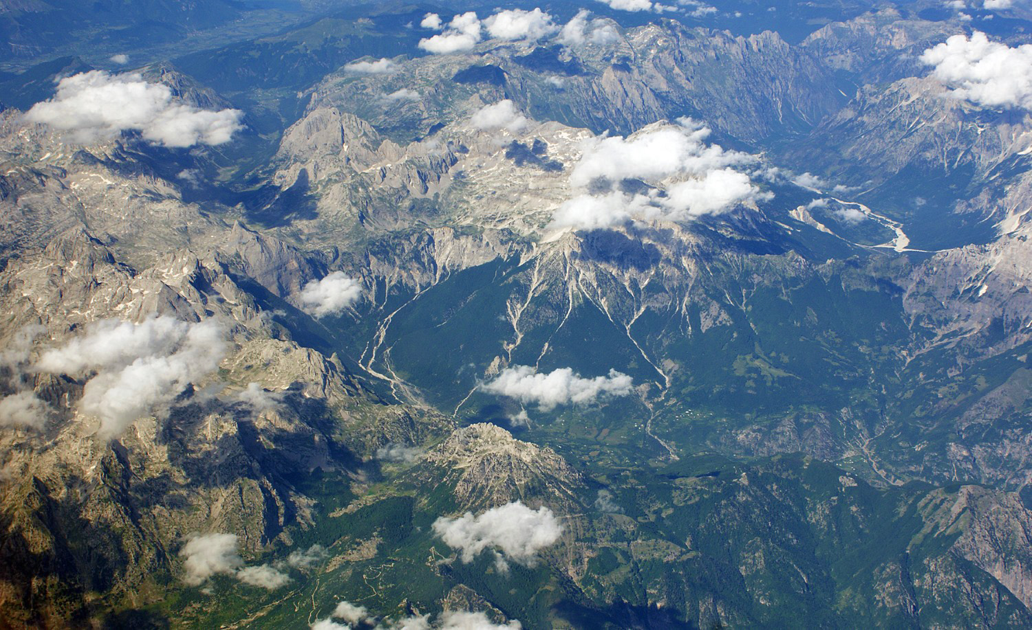 Aerial view of the Albanian Alps showing the deep glacial valleys of Theth and Valbona